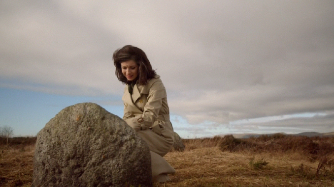 Claire at Fraser grave, Culloden